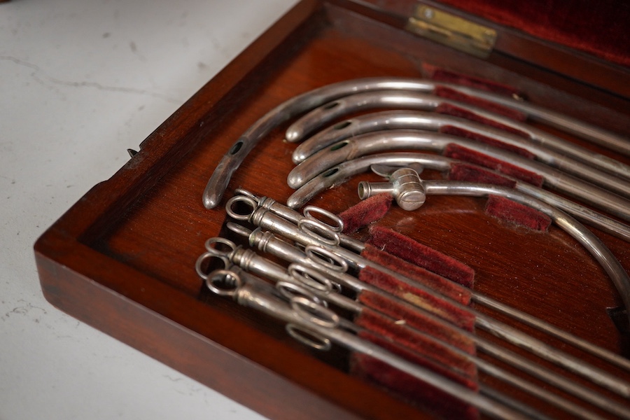 A mid 19th century mahogany cased medical set of catheter surgical instruments, inset plate to the lid engraved with ‘Wimbledon 1865. T. Wright, RHR’, 33cm wide. Condition - fair to good.